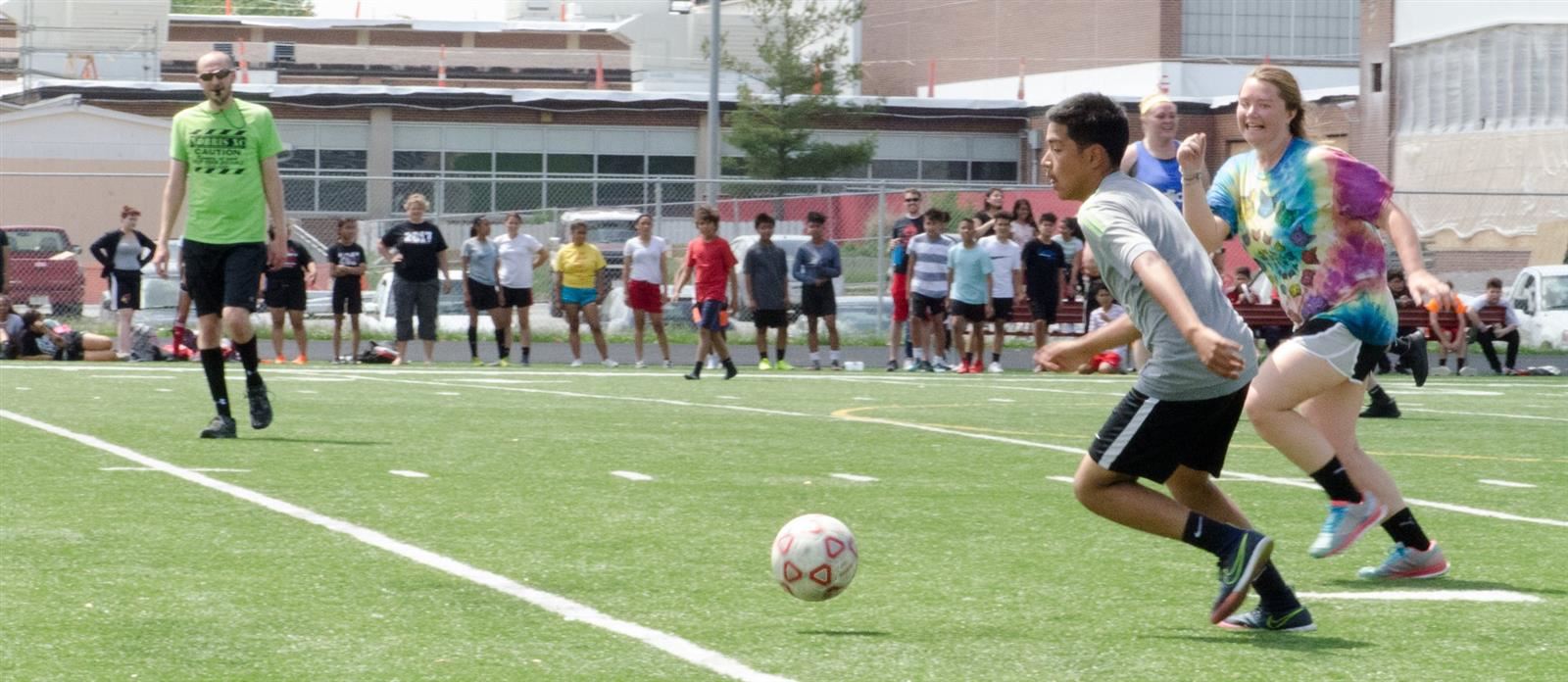 Students playing soccer